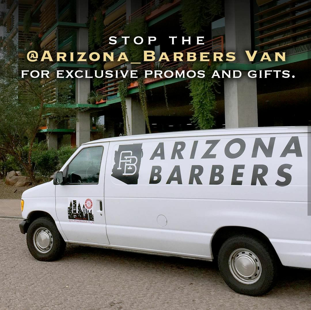 White Arizona Barbers promotional van parked on street with logo decals and event messaging