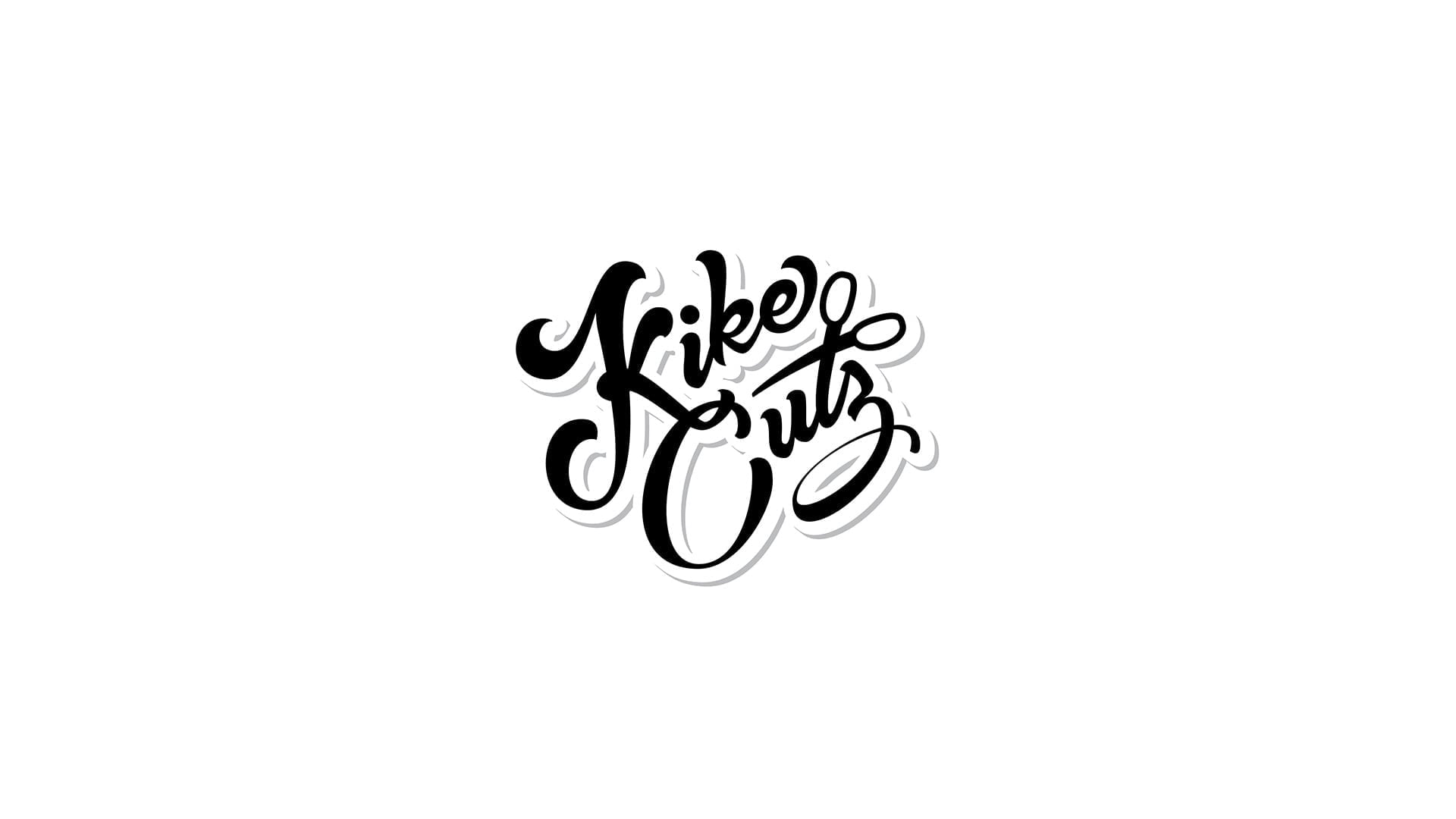 Kike Cutz barbershop logo featuring flowing black script lettering with subtle gray drop shadow on clean white background, stacked two-line layout